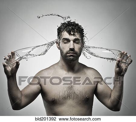 Stock Image - Man splashing himself with water. Fotosearch