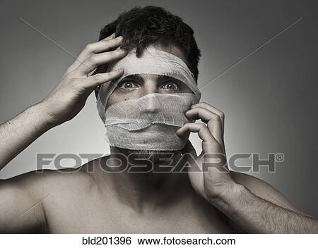 Man with bandages on his face View Large Photo Image Stock Photograph - Man with bandages on his face. Fotosearch