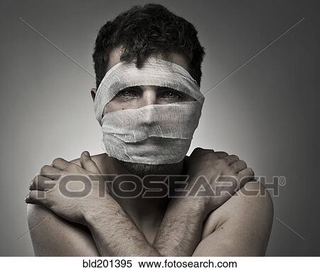 Stock Photography - Man with bandages on his face. Fotosearch