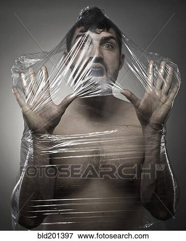 Man wrapped in plastic View Large Photo Image Stock Photo - Man wrapped in plastic. Fotosearch
