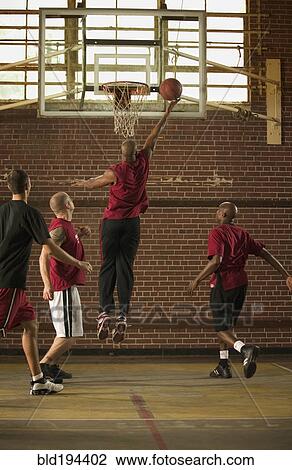 Men playing basketball View Large Photo Image Stock Image - Men playing basketball. Fotosearch