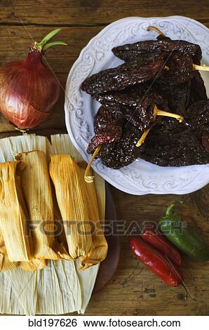 Mexican tamales, chilles, peppers and jalapenos View Large Photo Image Stock Photograph - Mexican tamales, chilles, peppers and jalapenos. Fotosearch