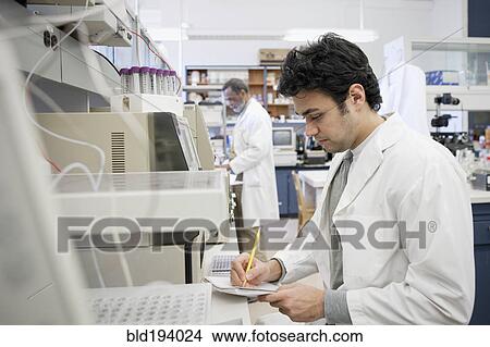 Picture - Middle Eastern scientist working in laboratory. Fotosearch