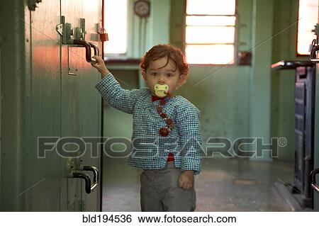 Mixed race boy standing in kitchen View Large Photo Image Stock Photograph - Mixed race boy standing in kitchen. Fotosearch