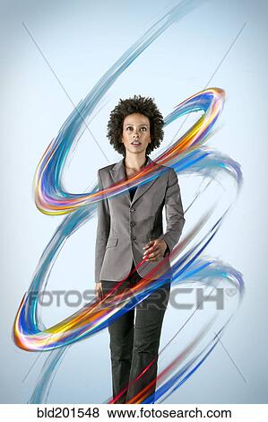 Stock Photo - Mixed race businesswoman surrounded by colorful lines. Fotosearch