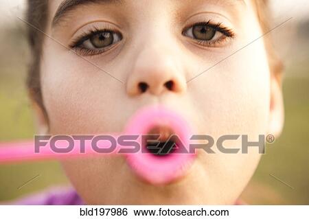 Mixed race girl blowing bubbles View Large Photo Image Stock Photograph - Mixed race girl blowing bubbles. Fotosearch