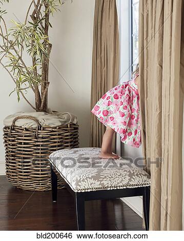 Mixed race girl looking out window View Large Photo Image Stock Photograph - Mixed race girl looking out window. Fotosearch