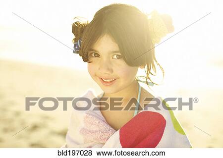 Mixed race girl on beach wrapped in towel View Large Photo Image Stock Photo - Mixed race girl on beach wrapped in towel. Fotosearch