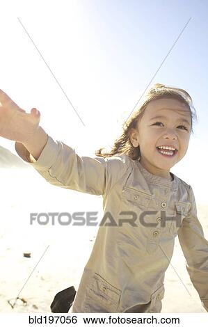 Mixed race girl, running outdoors View Large Photo Image Stock Photograph - Mixed race girl, running outdoors. Fotosearch
