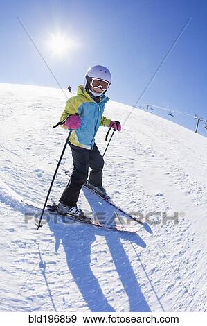 Mixed race girl skiing downhill View Large Photo Image Stock Photo - Mixed race girl skiing downhill. Fotosearch