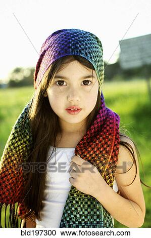 Mixed race girl wearing colorful headscarf View Large Photo Image Stock Image - Mixed race girl wearing colorful headscarf. Fotosearch