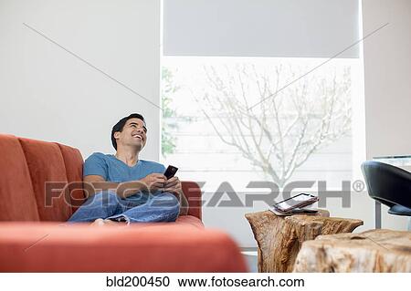 Mixed race man text messaging on cell phone View Large Photo Image Stock Image - Mixed race man text messaging on cell phone. Fotosearch