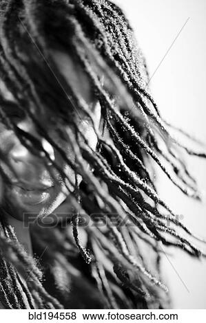Stock Photo - Mixed race man with long dreadlocks. Fotosearch