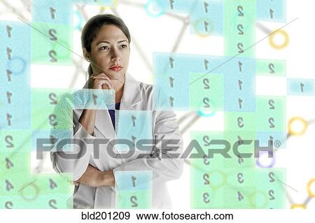 Mixed race scientist looking at numbers View Large Photo Image Stock Photo - Mixed race scientist looking at numbers. Fotosearch