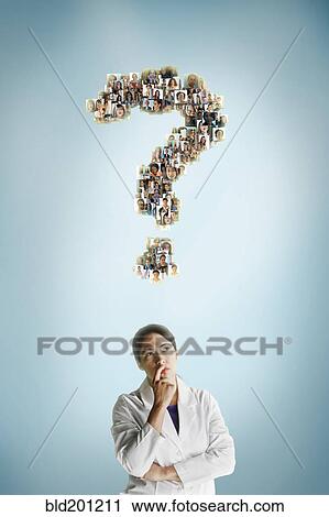 Stock Image - Mixed race scientist underneath question mark collage. Fotosearch