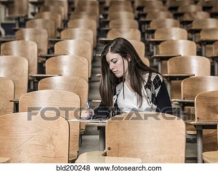 Stock Photo - Mixed race student studying in classroom. Fotosearch