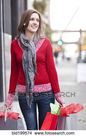 Mixed race woman shopping View Large Photo Image Picture - Mixed race woman shopping. Fotosearch