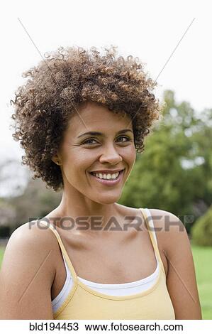 Stock Image - Mixed race woman smiling. Fotosearch