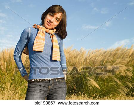 Stock Photo - Mixed race woman standing outdoors. Fotosearch