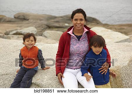 Mother and boys enjoying the beach View Large Photo Image Stock Image - Mother and boys enjoying the beach. Fotosearch