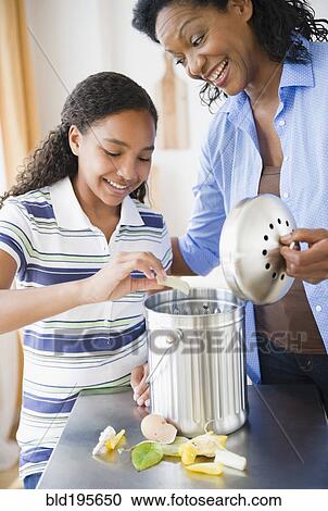 Mother and daughter composting together View Large Photo Image Stock Image - Mother and daughter composting together. Fotosearch