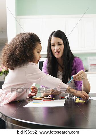 Mother and daughter doing arts and crafts together View Large Photo Image Stock Image - Mother and daughter doing arts and crafts together. Fotosearch