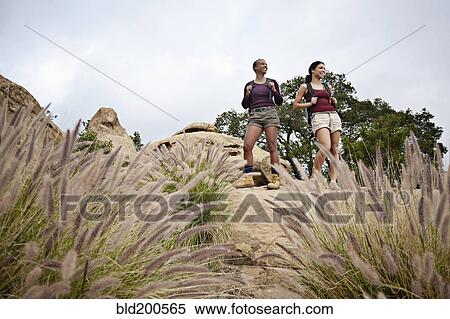 Stock Photography - Mother and daughter hiking together. Fotosearch