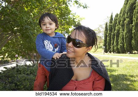 Mother and son enjoying park View Large Photo Image Picture - Mother and son enjoying park. Fotosearch