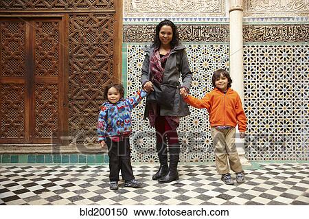 Mother and sons in Moroccan building View Large Photo Image Stock Image - Mother and sons in Moroccan building. Fotosearch