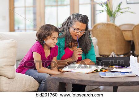 Mother helping daughter with homework View Large Photo Image Stock Image - Mother helping daughter with homework. Fotosearch