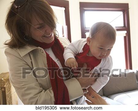 Mother holding baby girl View Large Photo Image Stock Photography - Mother holding baby girl. Fotosearch
