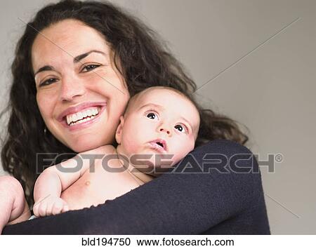 Mother holding newborn baby View Large Photo Image Stock Image - Mother holding newborn baby. Fotosearch