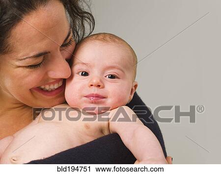 Stock Image - Mother holding newborn baby. Fotosearch