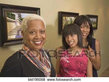 Stock Photo - Multi-generation family in gallery. Fotosearch