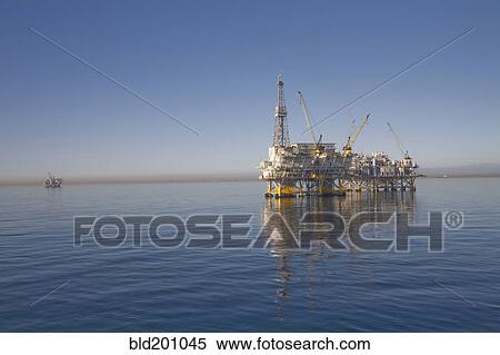 Oil rig on the ocean View Large Photo Image Stock Photography - Oil rig on the ocean. Fotosearch