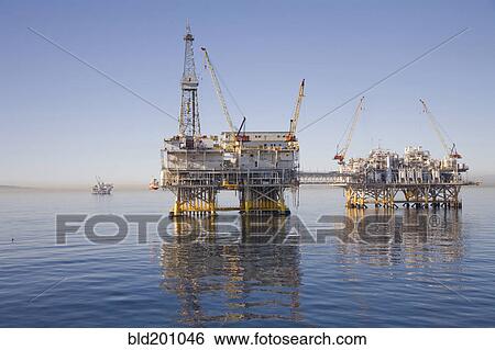 Stock Photograph - Oil rigs on the ocean. Fotosearch