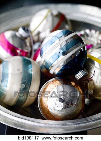 Stock Photo - Old-fashioned Christmas ornaments in bowl. Fotosearch