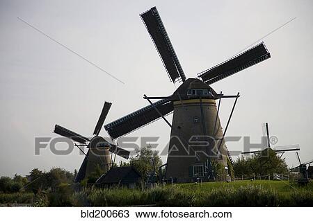 Old-fashioned Dutch windmills View Large Photo Image Stock Image - Old-fashioned Dutch windmills. Fotosearch