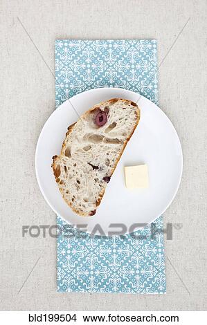 Picture - Olive bread and butter on plate. Fotosearch