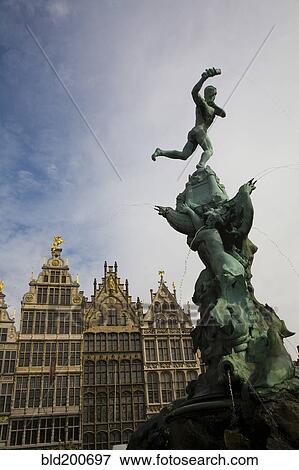 Ornate fountain with buildings in background View Large Photo Image Stock Photo - Ornate fountain with buildings in background. Fotosearch