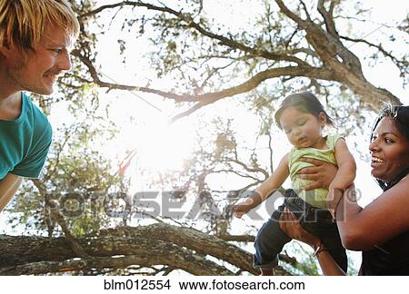 Parents playing with baby boy View Large Photo Image Picture - Parents playing with baby boy. Fotosearch