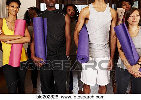 People holding yoga mats View Large Photo Image Stock Photograph - People holding yoga mats. Fotosearch