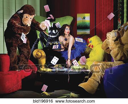 Stock Photograph - People in animal costumes playing poker. Fotosearch