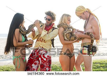 People looking at boa constrictors on beach View Large Photo Image Stock Image - People looking at boa constrictors on beach. Fotosearch