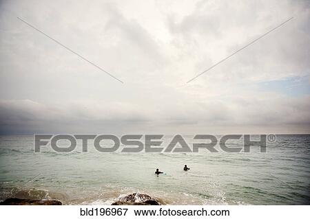 Stock Photo - People swimming in ocean. Fotosearch
