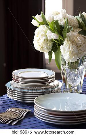 Plates and silverware on table View Large Photo Image Stock Photography - Plates and silverware on table. Fotosearch