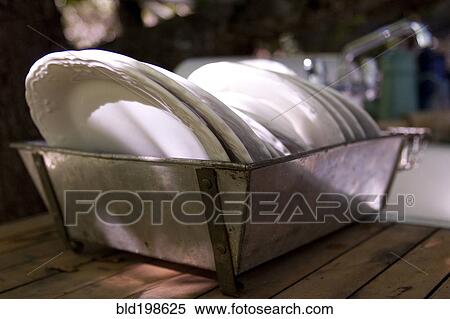 Plates drying in drainer View Large Photo Image Stock Photography - Plates drying in drainer. Fotosearch