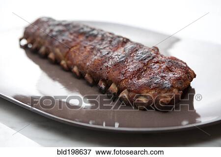 Pork ribs on platter View Large Photo Image Stock Photo - Pork ribs on platter. Fotosearch