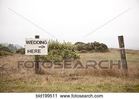 Post in field with sign - Wedding here View Large Photo Image Stock Image - Post in field with sign - Wedding here. Fotosearch