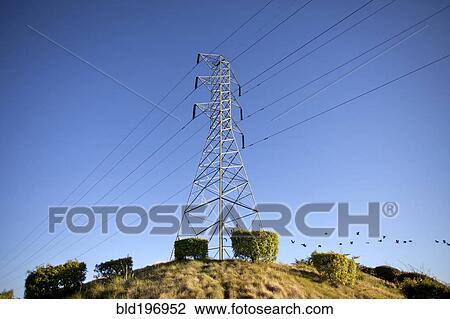 Stock Image - Power line on hilltop. Fotosearch